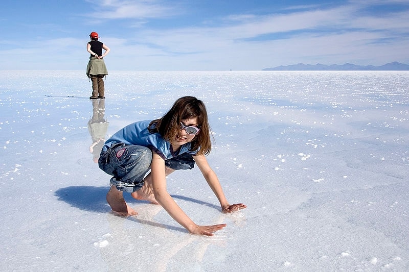 http://commons.wikimedia.org/wiki/File:Giulia_on_wet_Salar_de_Uyuni_Bolivia_Luca_Galuzzi_2006.jpg