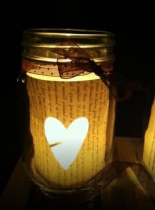 Cut a heart on paper and paste it in the jar, then put a candle.