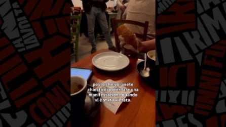 Il video dell'attivista portata via dalla polizia mentre fa colazione in un bar a Mantova